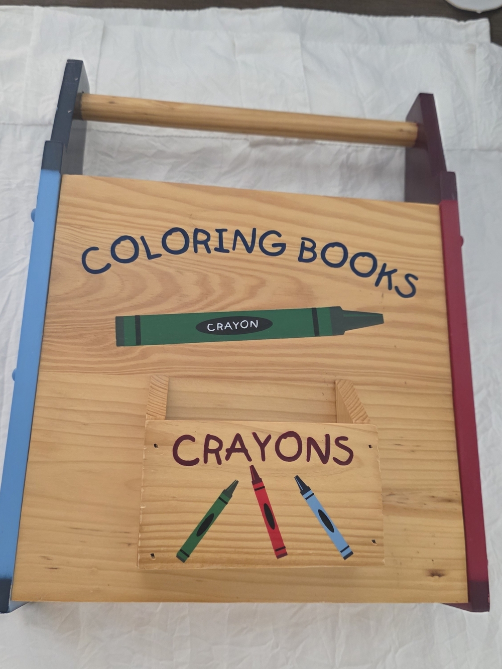 The solid wooden crayon/coloring book holder